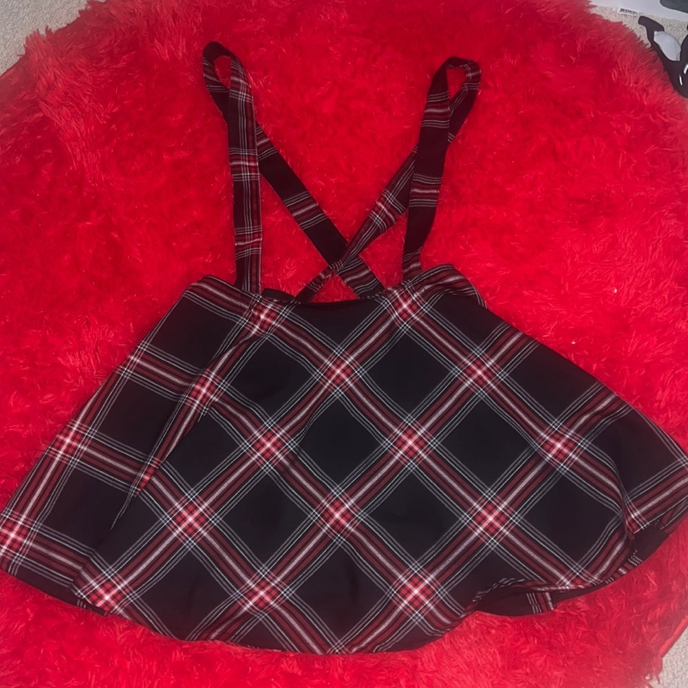 black, white, and red plaid skirt with suspenders